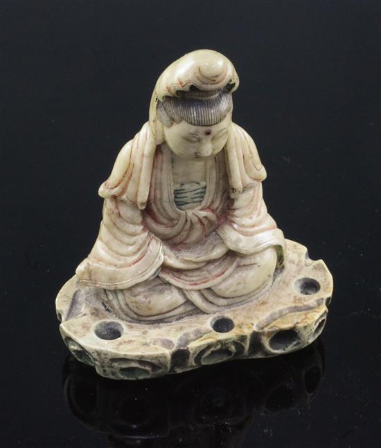 A Chinese soapstone seated figure of Guanyin, 18th century, 9cm